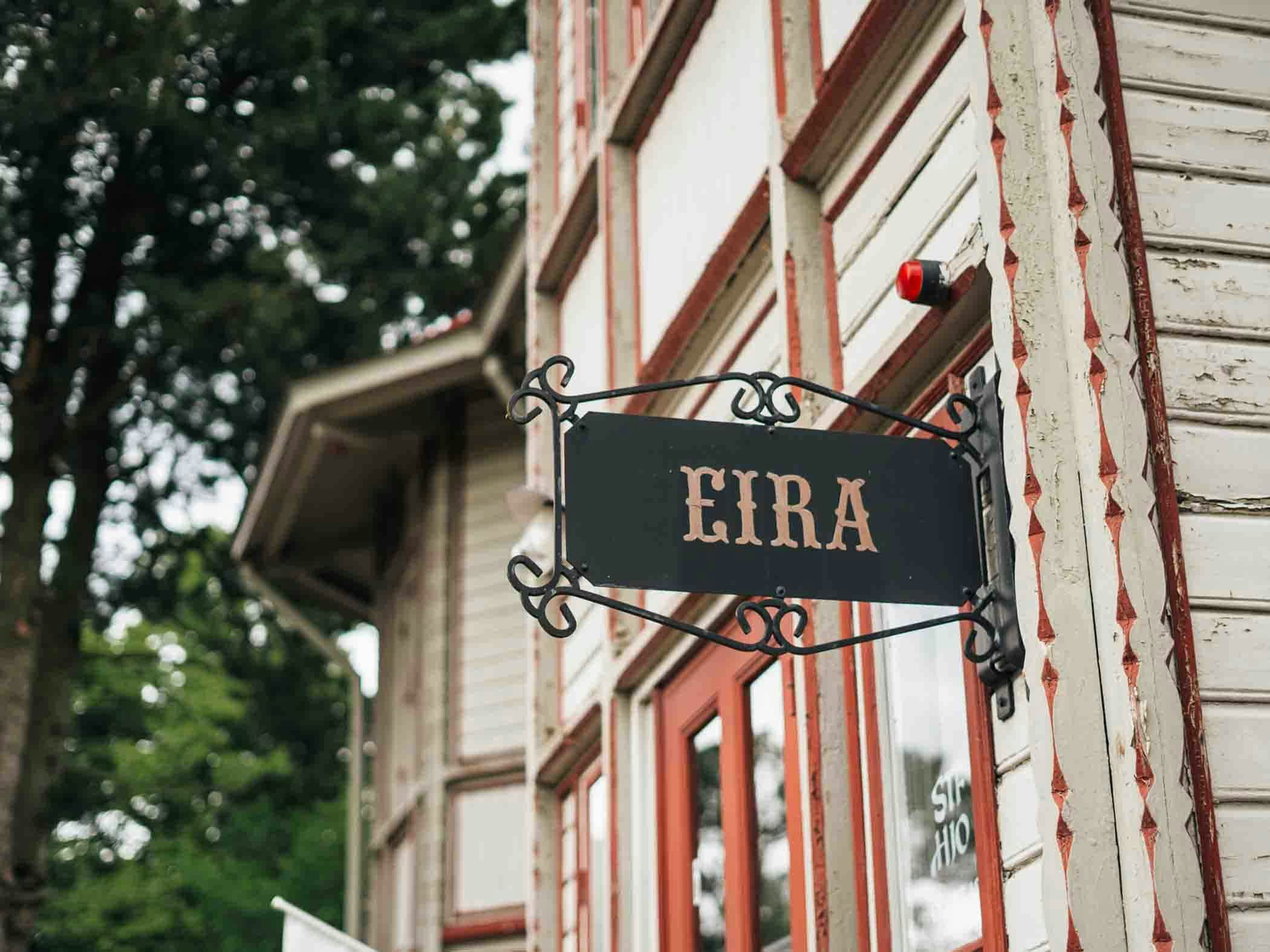 A black wrought iron sign with the text 