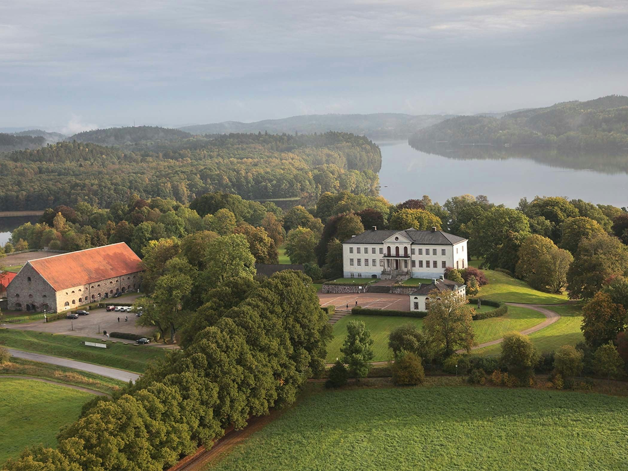 Manor house with views of winding lake and deep forests – where history meets tranquility.