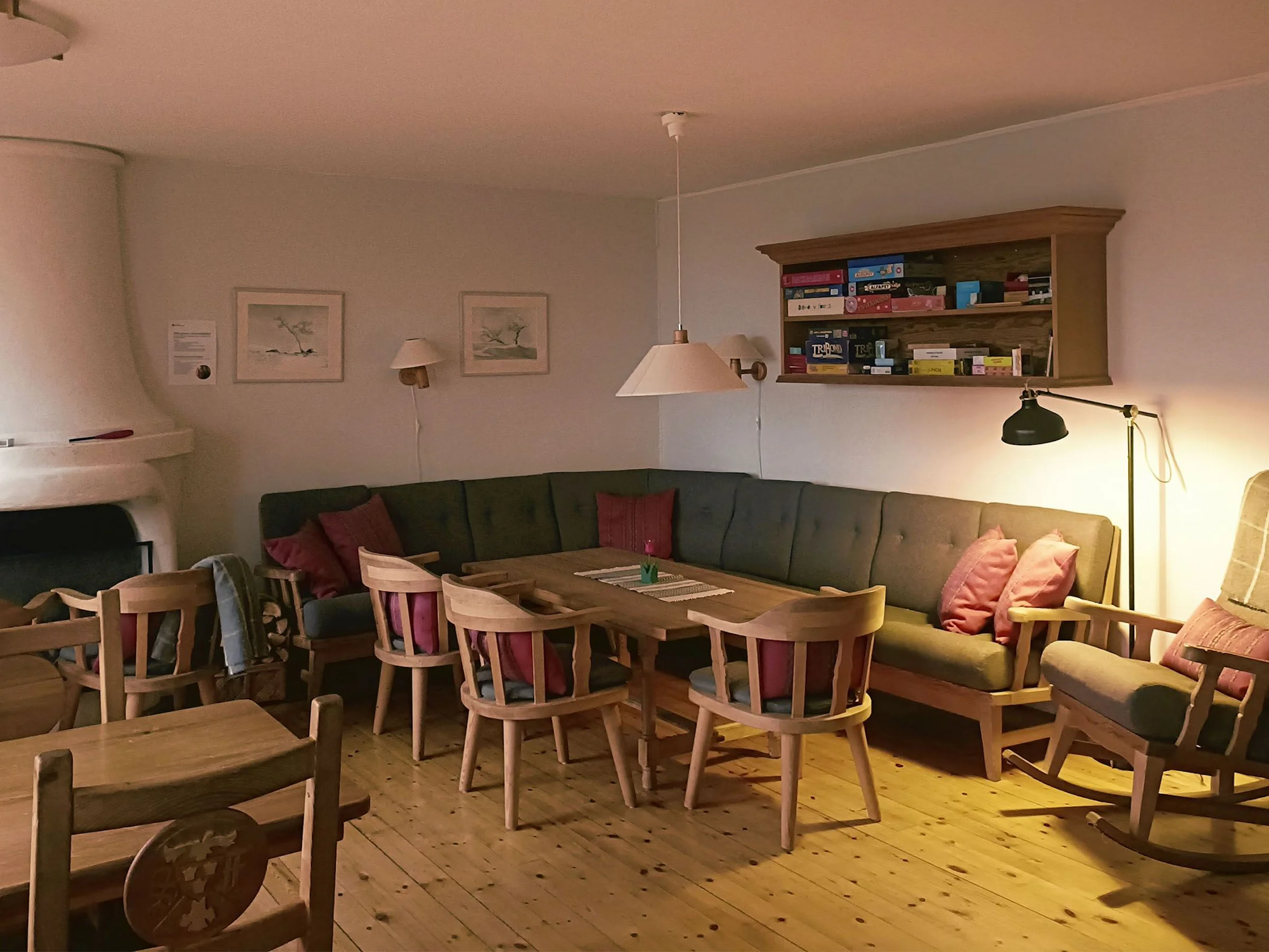 Lounge with a sofa and small tables.